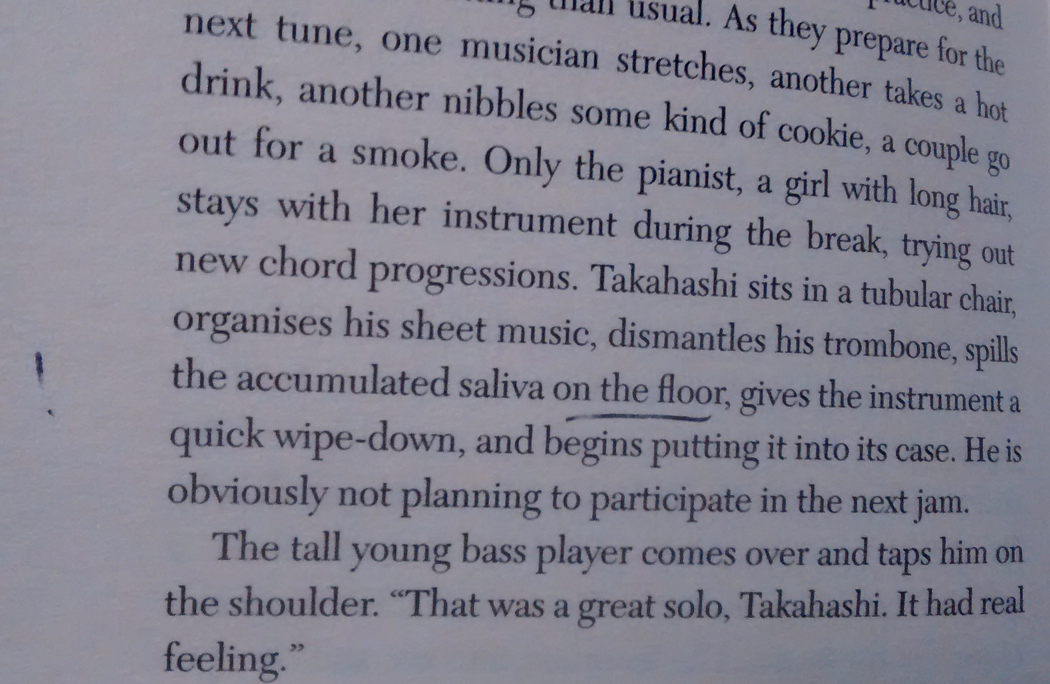 After Dark by Haruki Murakami, with accumulated saliva on the floor