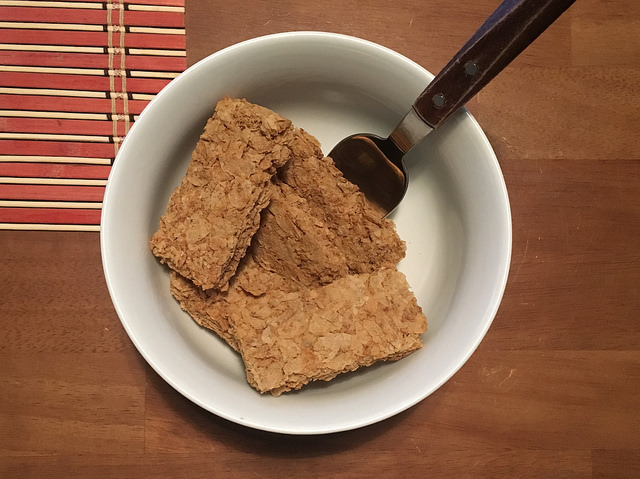 weet-bix wheat biscuits in bowl with no milk and spoon