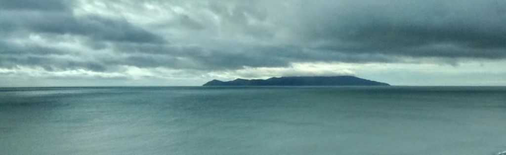 Kapiti Island on a cloudy day over the Tasman Sea