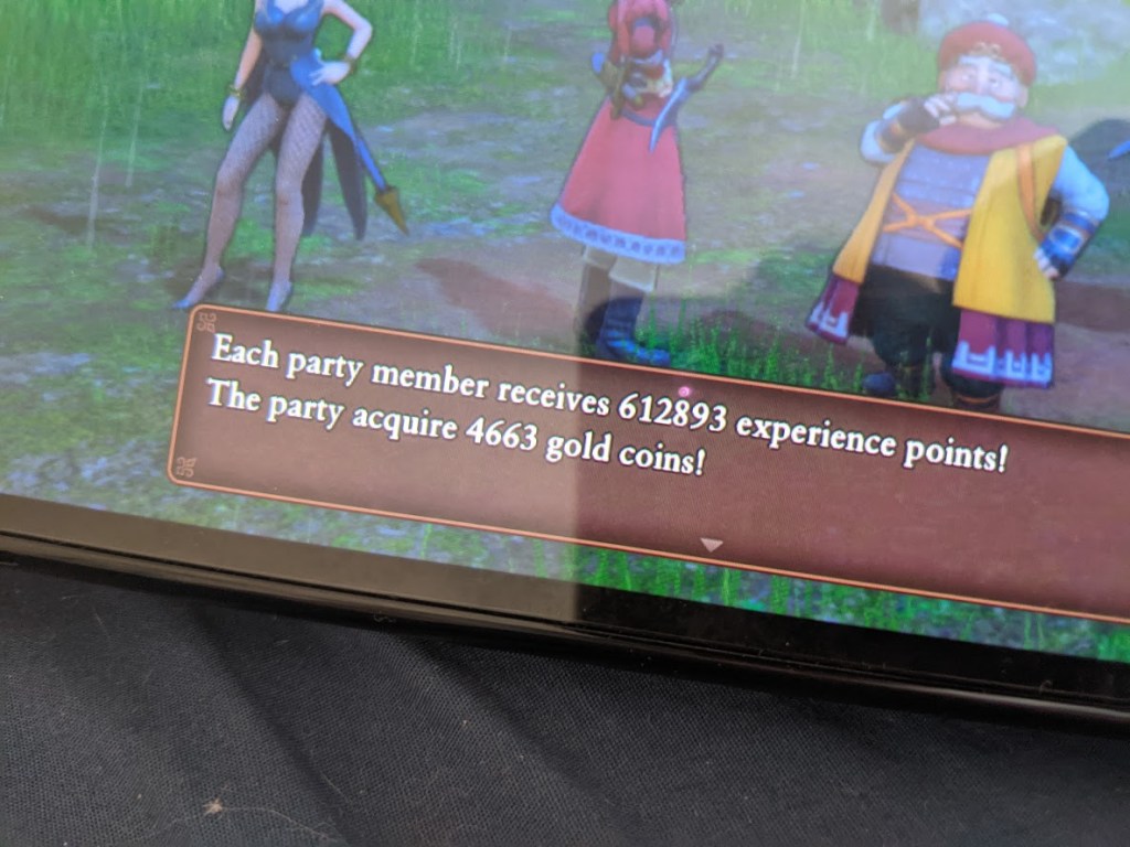 Screenshot from a video game showing characters receiving experience points and gold coins.
